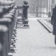 woman walking down a city street during a very cold and snowy day